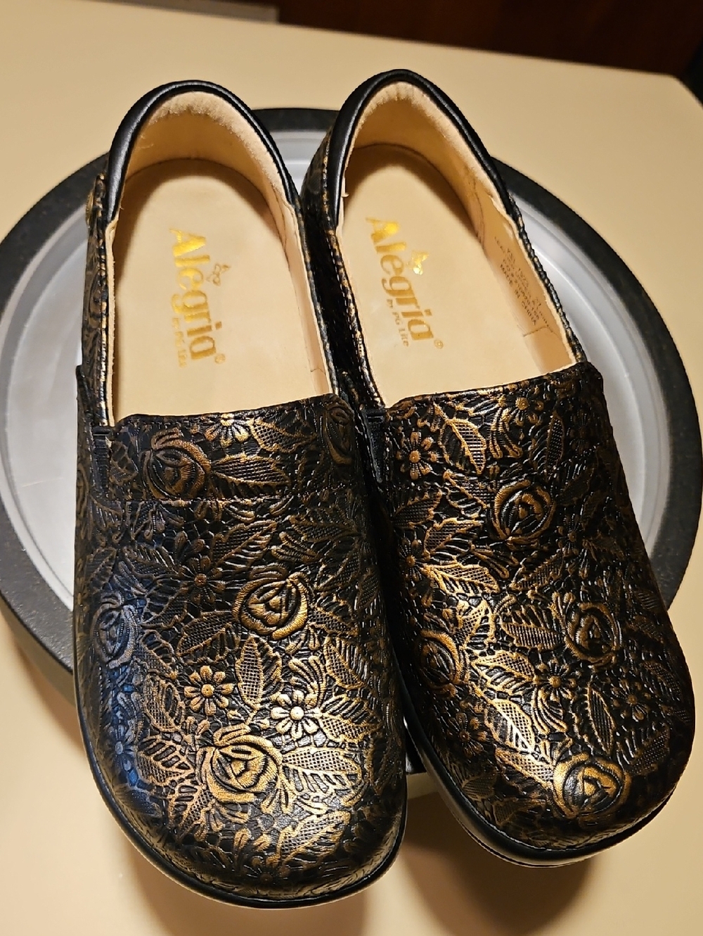 Alegria Black and Gold Floral Embossed Moccasins